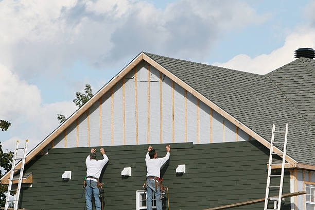 Professional Emergency Siding Repair technician working in Warfield, VA